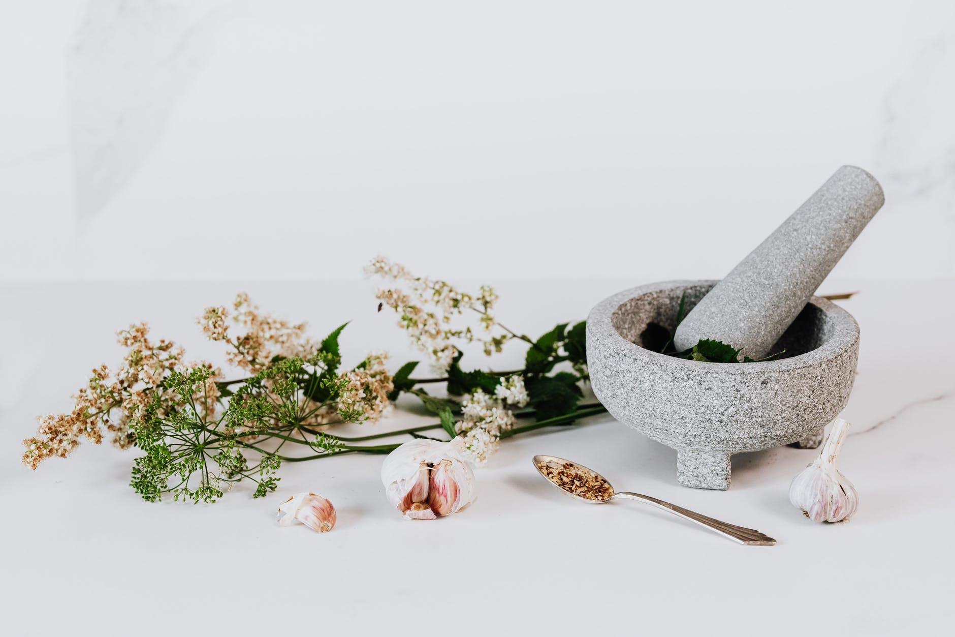 white flower on white ceramic vase